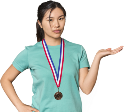 Chinese athlete showing a medal showing a copy space on a palm and holding another hand on waist.