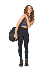 Fototapeta premium Full-body gym redhead having a shoulder pain.
