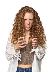 Simple redhead studio portrait upset screaming with tense hands.