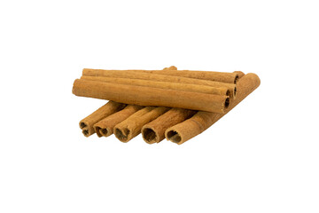 Cinnamon. Cinnamon sticks stacked on white