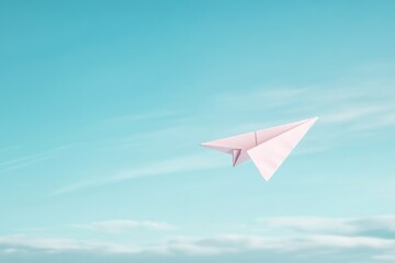 lone paper airplane mid-flight against soft uncluttered blue sky represents dreams and aspirations with ample copy