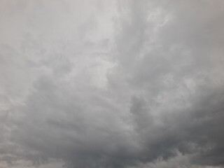 A cloudy sky filled with various shades of gray, creating a somber and overcast atmosphere.