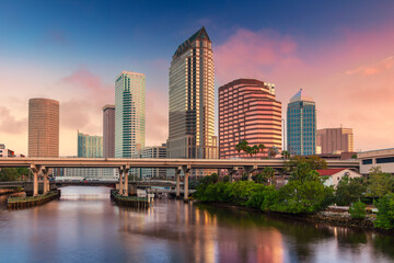 Tampa, Florida, USA. Cityscape image of Tampa, Florida with reflection of the city skyline in the water at beautiful sunrise.