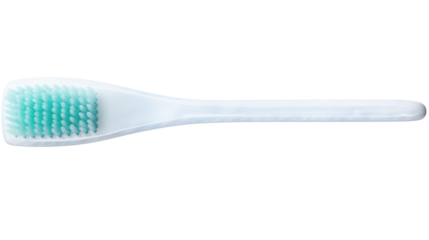 Close up of a white toothbrush with blue green bristles
