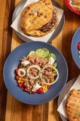 Delicious tuna salad with Assorted Side Dishes in the background