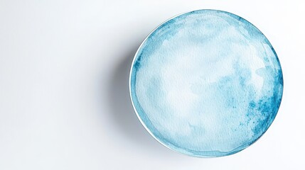 A circular watercolor painting features soothing shades of blue, resembling a serene abstract design against a clean background.