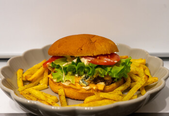 Homemade burger with blue cheese and air fryer fries.

