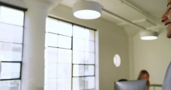 Businessman organizing documents in modern office, preparing for important meeting