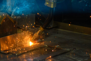 Close up scene the laser welding process by hand held laser welding machine.