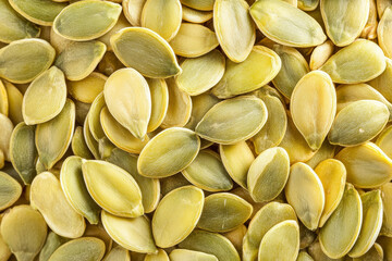 top view of golgen pumpkin seeds with copy space