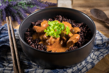 Thai red curry with chicken and black rice.