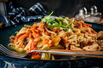 Fried chicken pieces with vegetables.