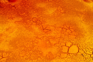 Abstract textures: cracked red earth underwater
