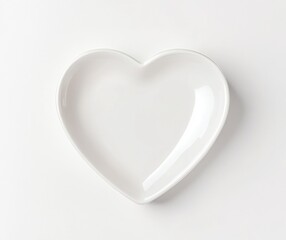 White Heart Shaped Plate on White Background Top View Valentine Concept