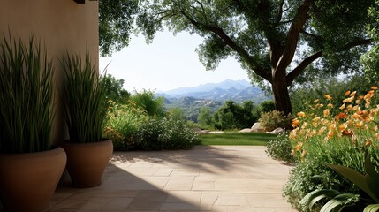 Fototapeta premium A serene outdoor scene with a stone pathway leading to a garden, with trees, flowers, and mountains in the distance
