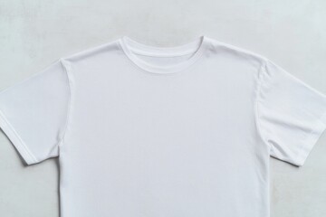close-up of blank t-shirt laid flat on smooth surface with ample copy space extending around garment
