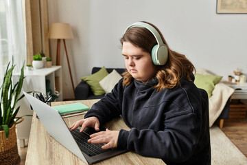 Young woman with Down syndrome enjoying a cozy moment at home while focused on work