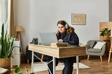Young woman with Down syndrome engaged in focused work at home in a cozy setting