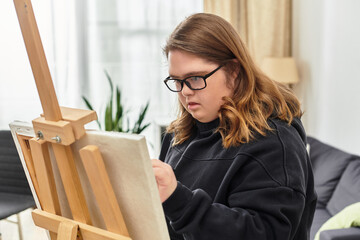 Creating art at home brings joy and confidence to a young woman with Down syndrome