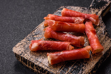 Cheese and meat, jamon or prosciutto rolled into a roll