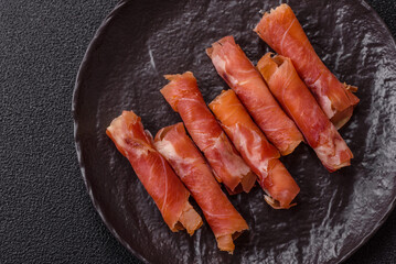 Cheese and meat, jamon or prosciutto rolled into a roll