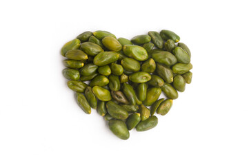 shelled raw pistachios in heart shape