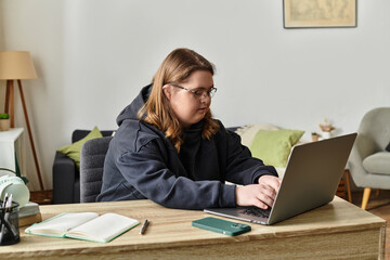 Young woman with Down syndrome confidently working at home in a cozy environment