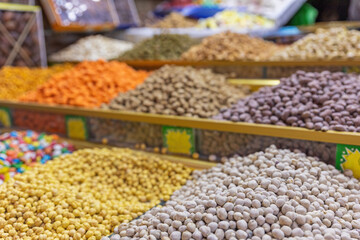 Piles of Moroccan Chickpeas at a stall in a market in Marrakech. Morocco. Horizontally.