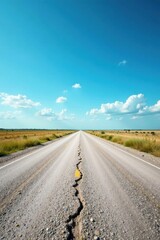 Naklejka premium Endless asphalt road stretching towards a vibrant summer sky with fluffy clouds, a cracked surface tells a story of journeys and time