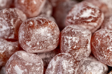 candied fruits of kumquat boiled in sugar syrup in powdered sugar