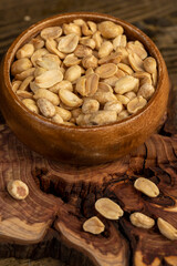 fried yellow peanuts with a little salt on the table
