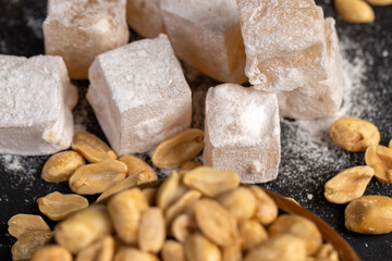 square Turkish delight in powdered sugar with nuts inside