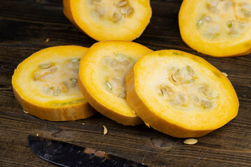 Slice natural yellow-orange ripe pumpkin or zucchini