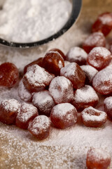 candied fruits of kumquat boiled in sugar syrup in powdered sugar