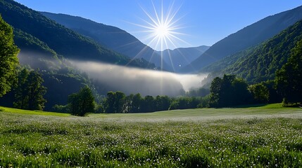 Fototapeta premium Sunrise over valley, fog rolling over the mountains, meadow in foreground. Use travel, tourism
