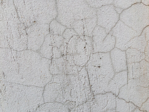 Abstract cracked grey concrete wall texture background