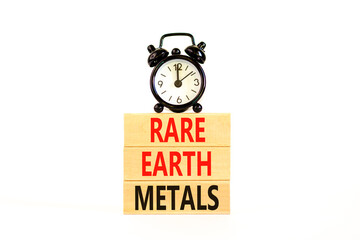 Rare earth metals symbol. Concept words Rare earth metals on beautiful wooden block. Black alarm...
