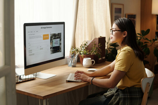 Young Woman Working on Desktop Computer Using Image Generator