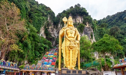 Statue of Lord Murugan and entrance at Batu Caves in Kuala Lumpur, Malaysia. Entrance to the cave complex with the Murugan statue in the front near Kuala Lumpur, Malaysia.