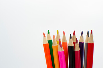 colored pencils on white background