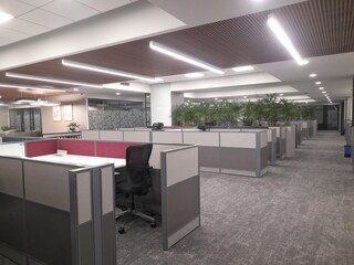 A well-designed corporate office blends functionality, style, and employee well-being. The layout typically includes open workspaces for collaboration, with adjustable desks and ergonomic furniture to