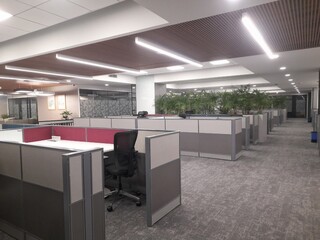 A well-designed corporate office blends functionality, style, and employee well-being. The layout typically includes open workspaces for collaboration, with adjustable desks and ergonomic furniture to