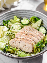 green salad with chicken, cucumber and broccoli