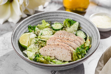 green salad with chicken, cucumber and broccoli