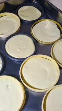 Typical and delicious Quesillos Yaguare&ntilde;os in circular molds ready for packaging in Yaguar&aacute;, Huila, Colombia. Colombian food concept