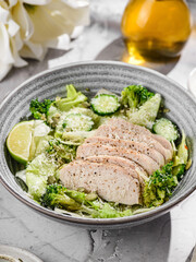 green salad with chicken, cucumber and broccoli