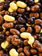 Luxury Chocolate-Covered Caramel. Macro Photography of Dark, Milk and White Chocolate Confections - Gourmet Candy Assortment in Rich Detail