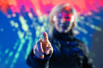 Elderly asian woman exploring virtual reality in metaverse