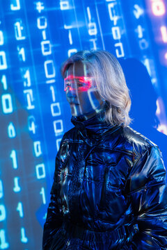 Elderly asian woman exploring the futuristic metaverse