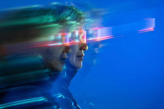 Elderly asian woman exploring the virtual metaverse